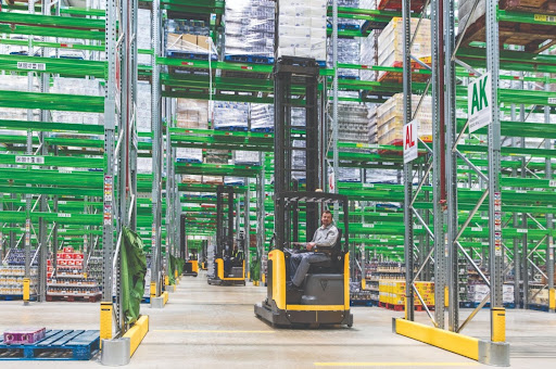 Warehouse operator on an electric reach truck