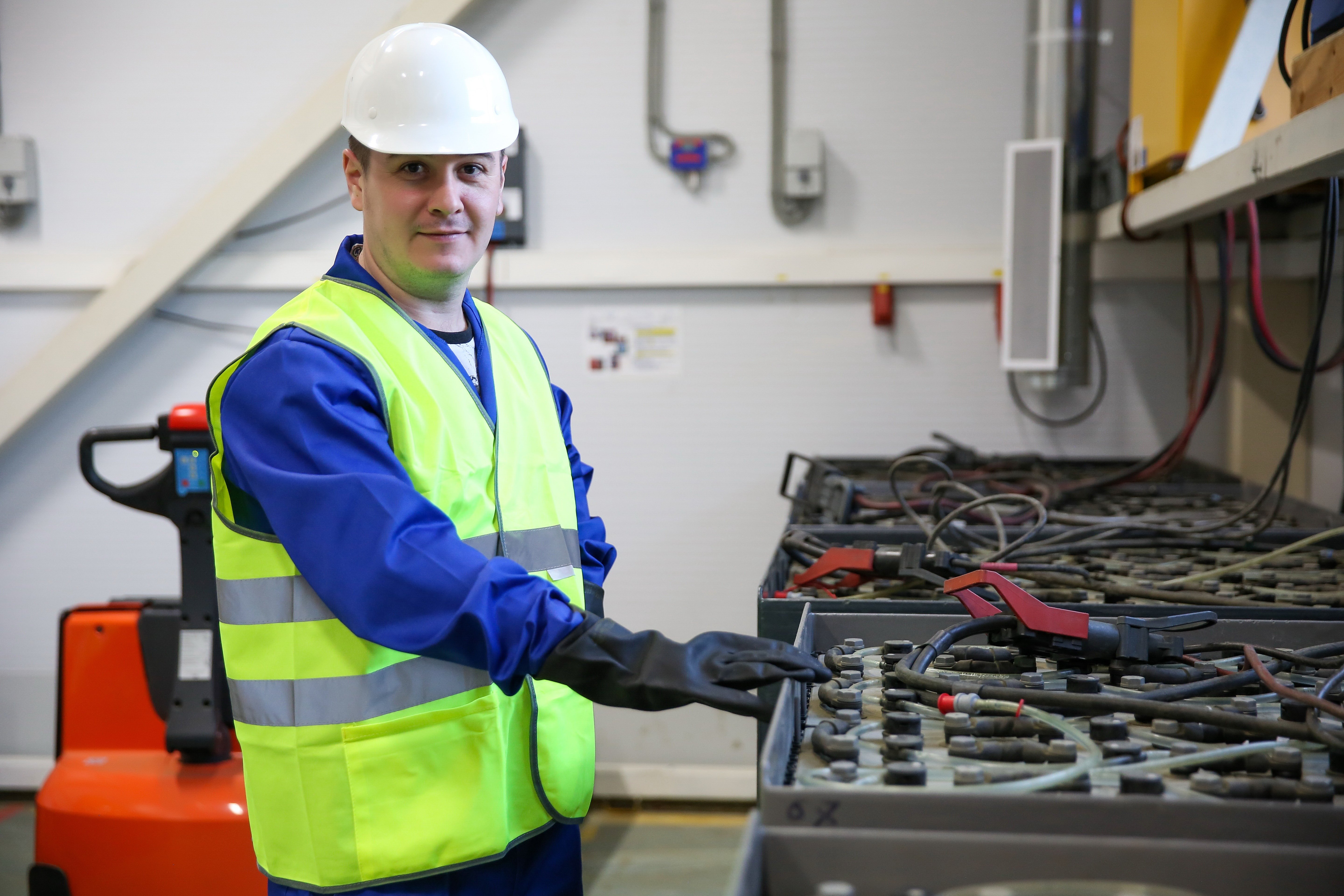 engineer checking a forklift battery