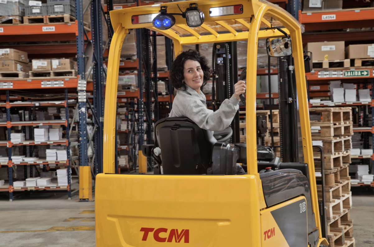 female warehouse operative tcm forklift size sit on pallet stacker